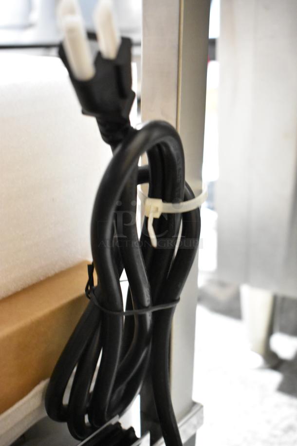 Power cord of a 2025 Vollrath FMA7036 36" Hot Food Merchandiser, 120V, 1 Phase, showing new condition with packaging.