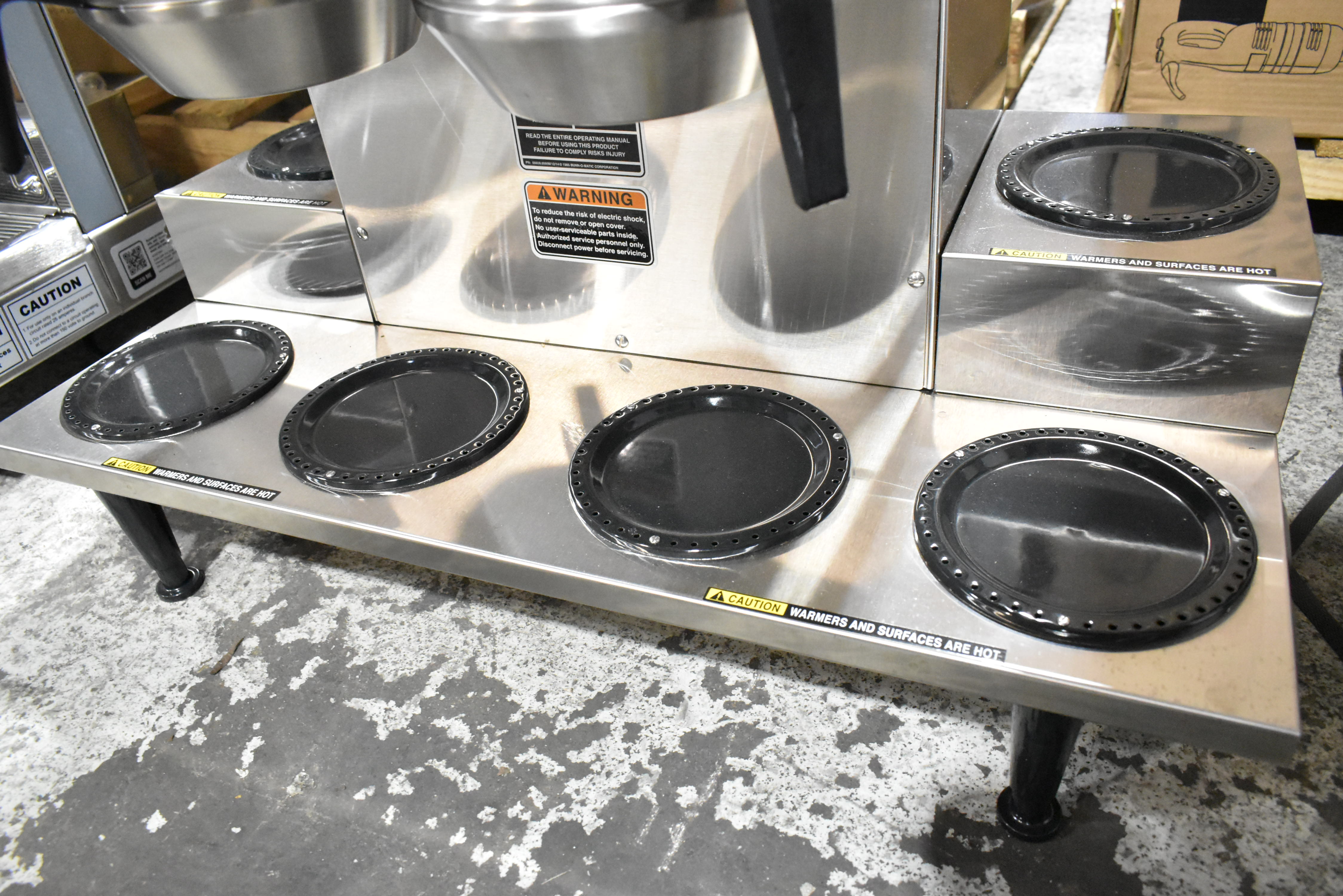 Close-up of commercial coffee warming plate element