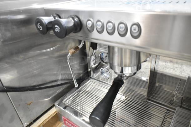 Brand new Estella ECEM2 two-group stainless steel espresso machine; includes 2 portafilters, 2 steam wands; unscrewed leg.