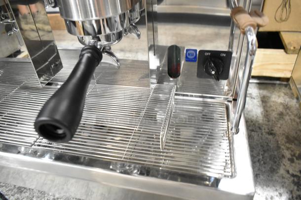 Estella ECEM2 stainless steel espresso machine, two groups, two portafilters, two steam wands, NSF certified. One leg issue.