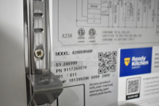 Close-up of Mainstreet 829BMR49F label on a stainless steel 2-door commercial freezer, indicating model and QR code.