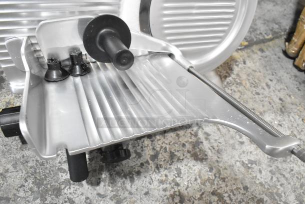 Brand new Globe G10 10" manual gravity feed slicer with blade sharpener, 1/3 hp, 115V, 1-phase. Scratch and dent condition.