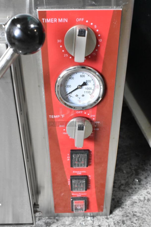 Brand new Avantco 177DPO18DS stainless steel countertop pizza/bakery oven controls, featuring timer and temperature settings.