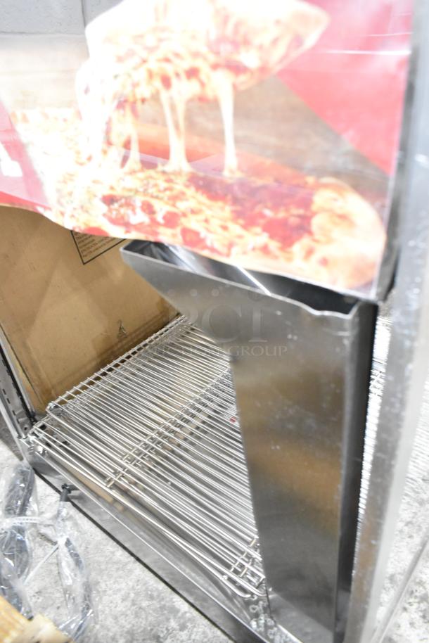 Stainless steel ServIt 423PDW18D1S display warmer, scratch and dent, 18" countertop model with 4 shelves, 115V, 1 phase.