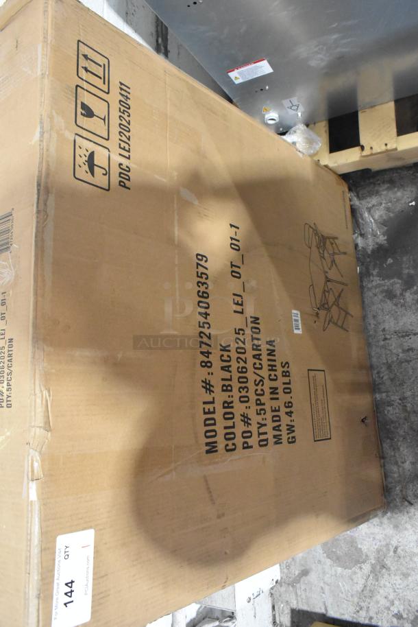 Cardboard box containing a brand new folding table, model 847254063579. Box shows minor dents. Marked "Made in China," color black.