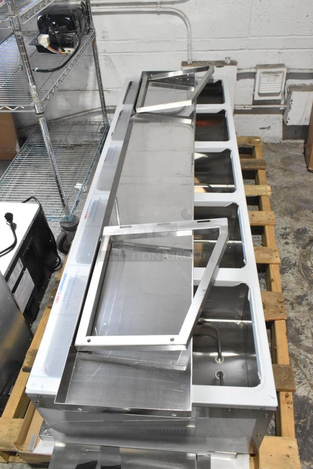 Brand new ServIt 423EST5WOPB five pan electric steam table with angled sneeze guard, partially enclosed base, 208/240V.