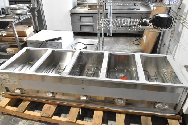 Brand new ServIt 423EST5WOPB five-pan electric steam table, partially enclosed base, angled sneeze guard, 208/240 volts.