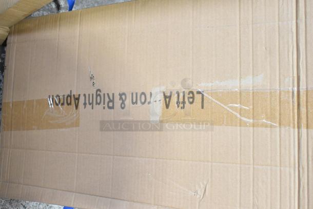 Brown cardboard box with text and tape, likely packaging for the ServIt 423EST5WOPB steam table. Visible scratch and dent on the surface.