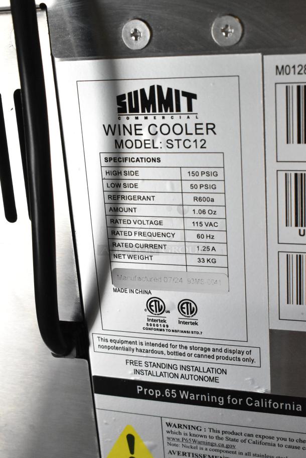 Summit STC12 wine cooler, stainless steel, 12-bottle capacity, brand new with minor scratches. Specifications label visible.