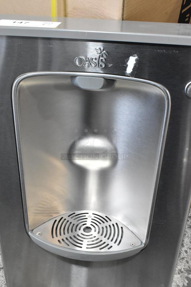 Stainless steel Oasis 507109 AquaPointe VersaFiller bottle filling station, new with minor scratches, 115V, non-refrigerated.