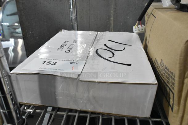 Lot of 4 brand new scratch and dent casters, model 1995074, in original packaging. Auction label reads "153 QTY 1".