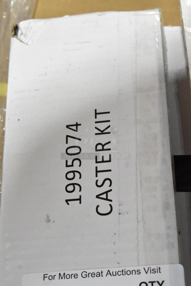 Box of 4 new scratch and dent casters, model 1995074, labeled "Caster Kit".