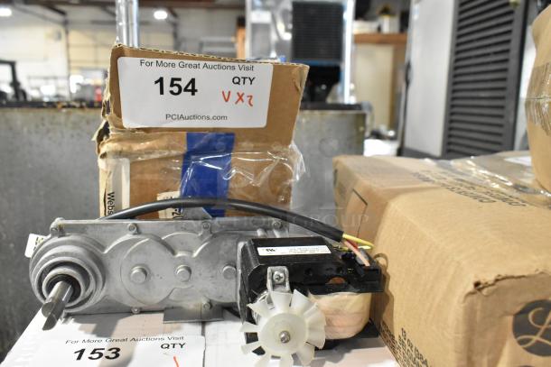 2 brand new scratch and dent items, including K935 unit and Maxair BT110 fan, shown in original packaging.