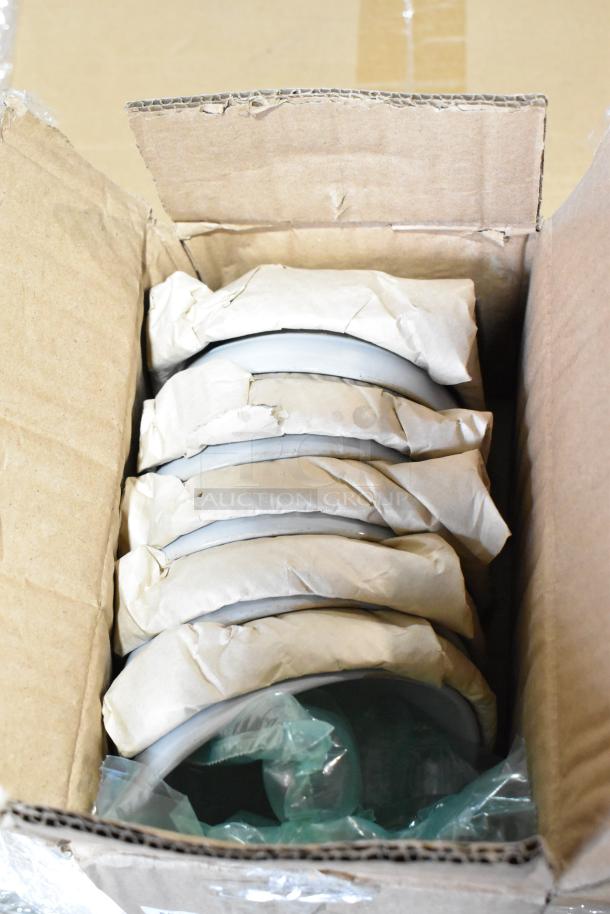 Cardboard box containing wrapped 957ARTBA11 porcelain bowls, Belgian beer glasses, and rocks glasses. New, scratch and dent condition.