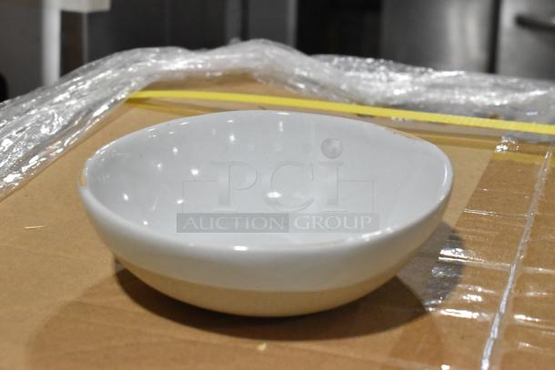 Brand new scratch and dent 957ARTBA11 Front of the House Artefact 11 oz. ash round porcelain bowl on cardboard.