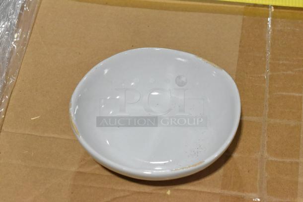 Brand new scratch and dent Artefact 11 oz. Ash Round Porcelain Bowl by Front of the House, showing mild surface imperfections.