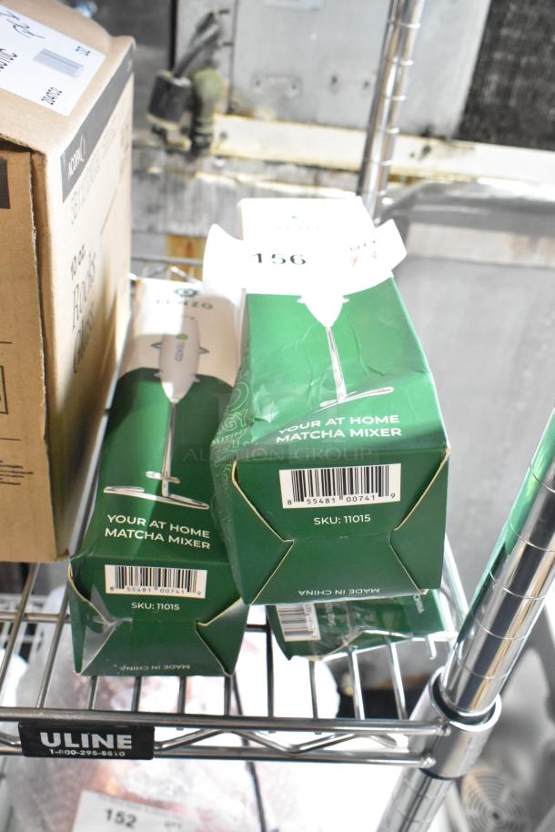 Three new Tenzo 9" white handheld milk frothers in green packaging, model 11015, scratched and dented, labeled as "Matcha Mixer."