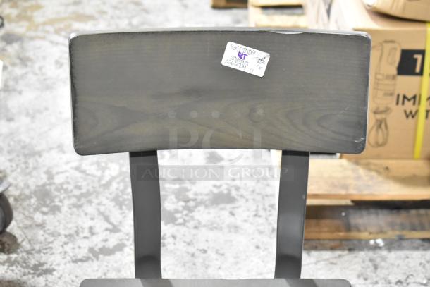 Brand new wooden ladder back dining chair with dark finish. Scratch and dent condition. Visible tag with item code.