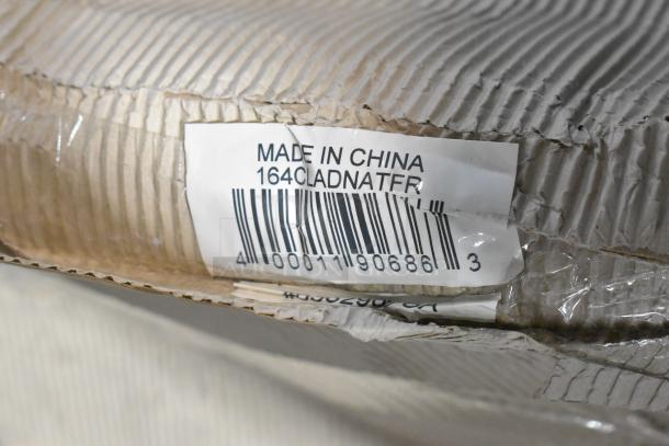 Label with "Made in China" and "164CLADNATFR" barcode on cardboard packaging for new dining chairs. Scratch and dent condition.