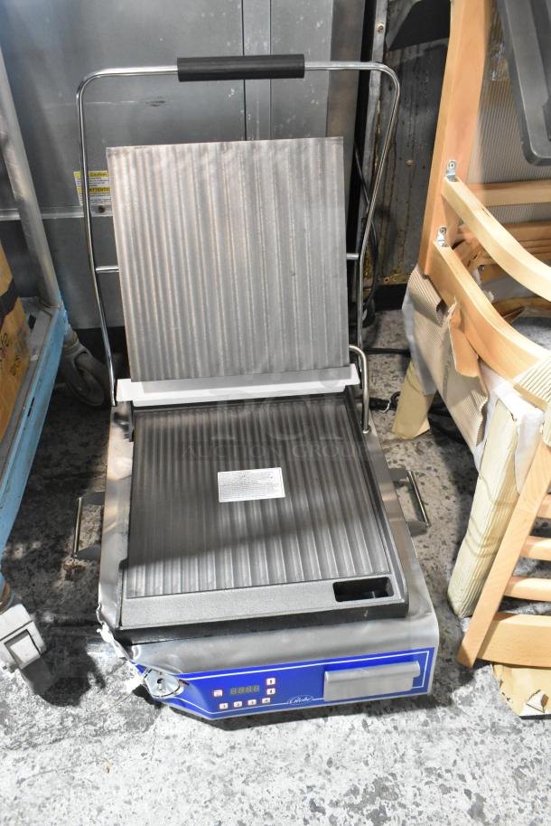 Brand new Globe GSG14D Deluxe Sandwich Grill, 14"x14" smooth plates, stainless steel, 120V, minor scratches.
