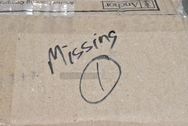 Cardboard box labeled "Missing 1" in black marker, containing scratch and dent glassware from Anchor Hocking and Acopa.