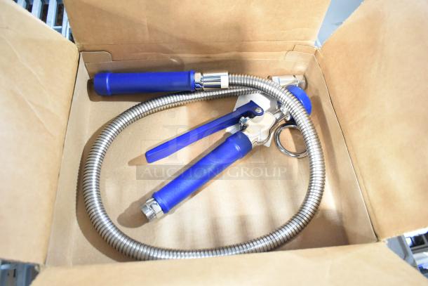 Brand new spray nozzle attachment in a box, blue handle, flexible metal hose, some surface scratches visible.