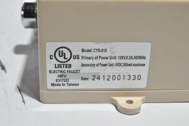 CYS-010 electric faucet label showing model, UL listing, voltage specs, and manufacturing details.