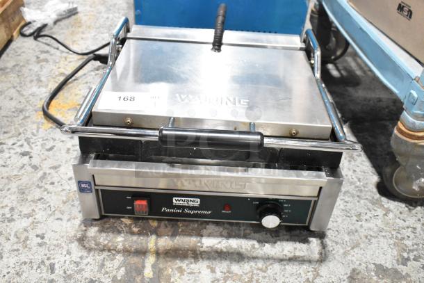 Waring WDG250 stainless steel countertop panini press, 120V, 1 phase, features temperature knobs and an on/off switch.