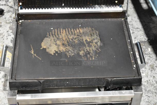 Waring WDG250 stainless steel commercial panini press, showing wear on cooking surface, 120 volts, 1 phase.