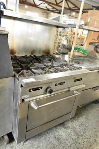 Garland X36-6R SunFire stainless steel commercial 6 burner range with oven, overshelf, and backsplash. Natural gas powered.