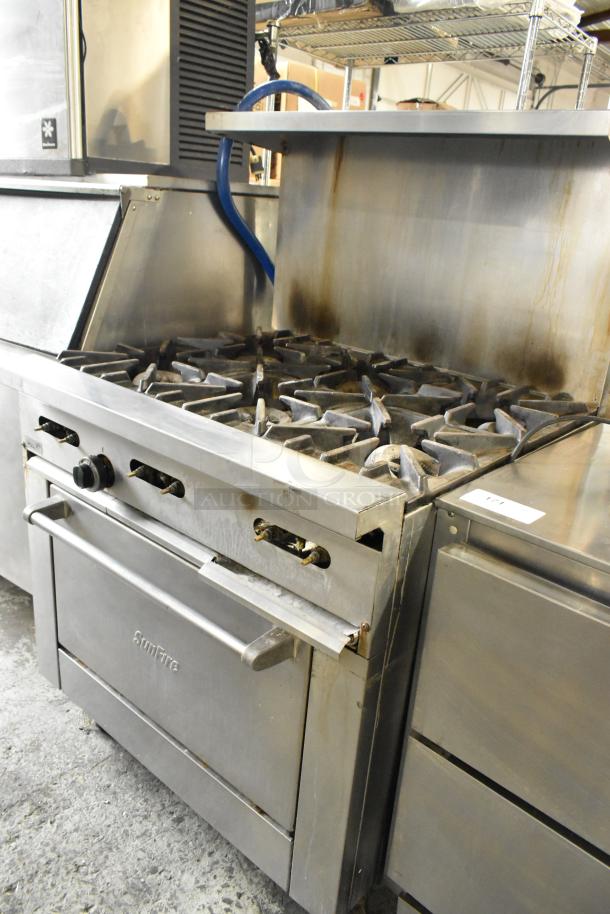Garland X36-6R SunFire stainless steel 6-burner range with oven, over shelf, and backsplash. Natural gas powered.