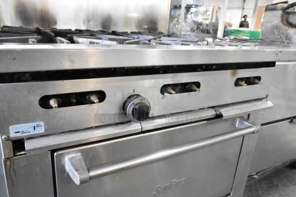 Garland X36-6R SunFire stainless steel commercial 6 burner range with oven, overshelf, and backsplash. Natural gas powered.