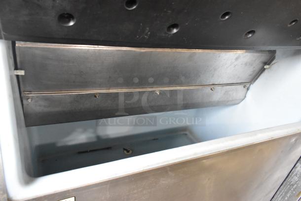 Manitowoc QD0452A stainless steel ice machine head on ice bin, 115 volts, 1 phase, commercial use. Good condition.