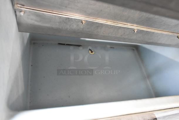 Manitowoc QD0452A stainless steel ice machine head on bin, 115V, 1 phase. Clean interior, minor wear.