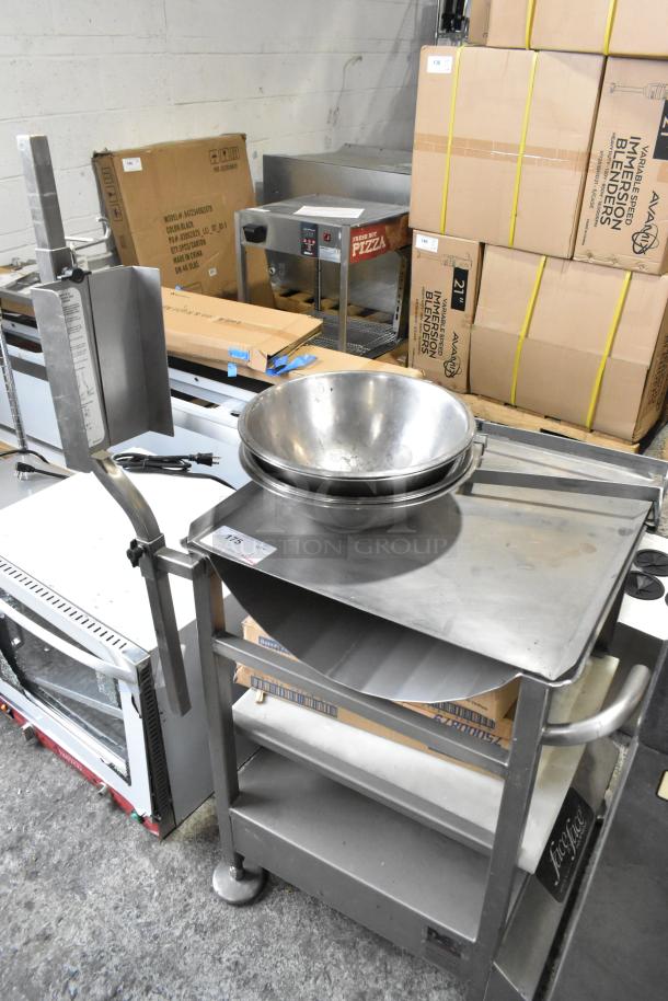 Stainless steel commercial meat slicer stand by M&E Manufacturing with metal bowls, used condition. Includes contents.