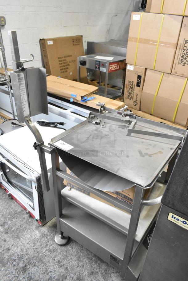 M&E Manufacturing stainless steel commercial meat slicer stand with metal bowls, showing minor wear, includes shelving.