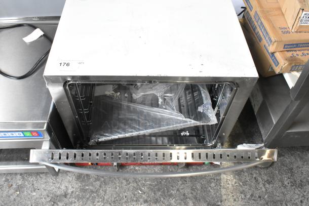 Brand new Avantco 177CO32M convection oven, 2.3 cu. ft., with glass damage, stainless steel, moisture injection feature, 208/240V.