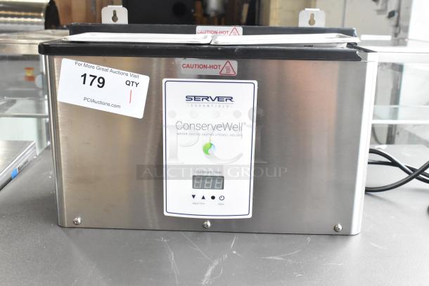 Brand new Server CW-T 87750 ConserveWell heated dipper well, 120V, with timer; minor scratches. "Caution: Hot" label visible.