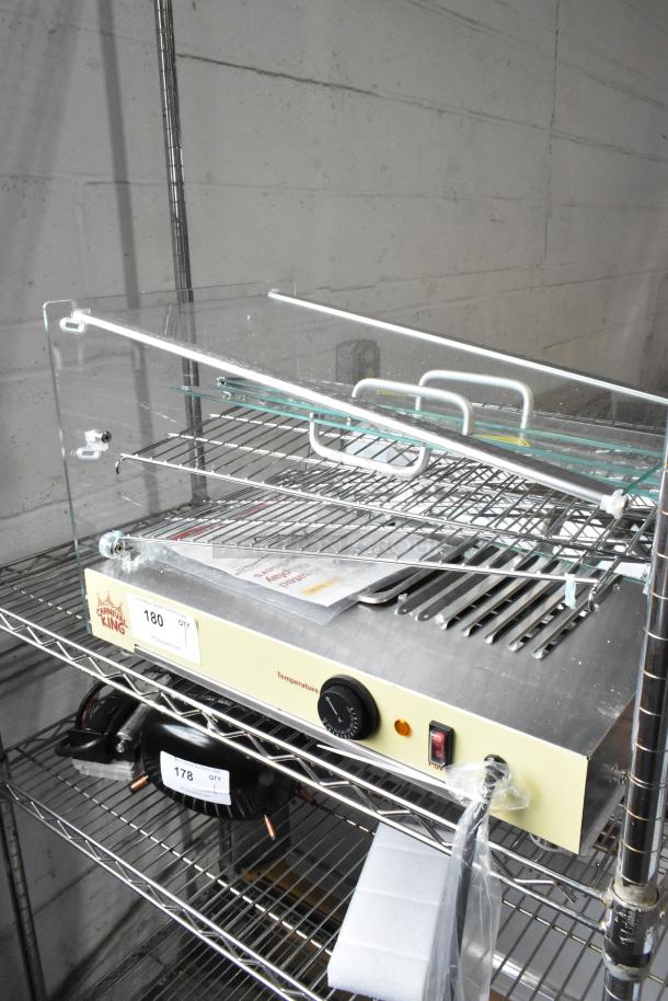 Carnival King 382HDSG2A hot food display case, silver, with 2 shelves, 120V, 1 phase. New with glass damage.