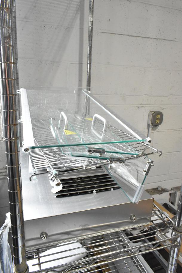 Carnival King 382HDSG2A silver glass hot food display case, 2 shelves, minor glass damage visible, 120V, new condition.