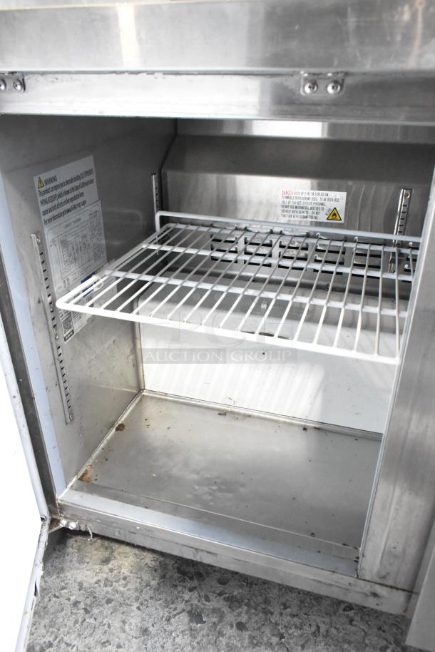 2022 Avantco 178AU48FHC stainless steel 2-door undercounter freezer on casters, interior view. 115V, 1 phase. Signs of use.
