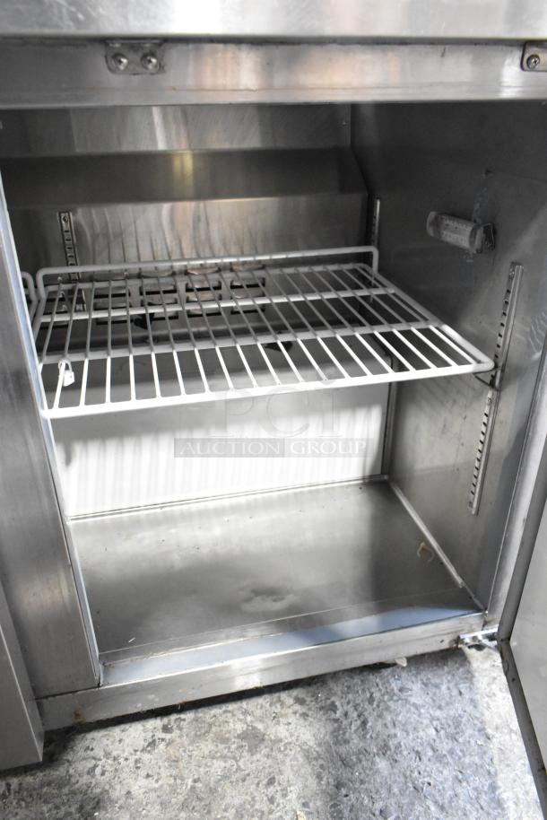 2022 Avantco 178AU48FHC stainless steel 2-door undercounter freezer with commercial casters; interior view, excellent condition.