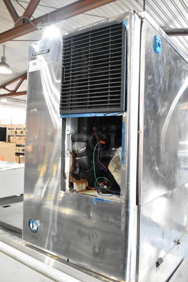 Hoshizaki stainless steel commercial ice machine on bin, 125/250 volts, 3 phase. Noticeable wear with exposed wiring and rust.