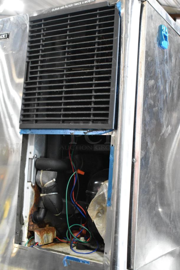 Hoshizaki stainless steel commercial ice machine, partially open, showing internal components. 125/250V, 3-phase. Rust visible.