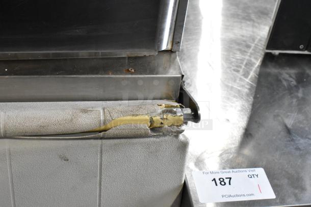Hoshizaki stainless steel commercial ice machine on ice bin. Visible wear on exterior. 125/250V, 3 phase. Auction tag 187.