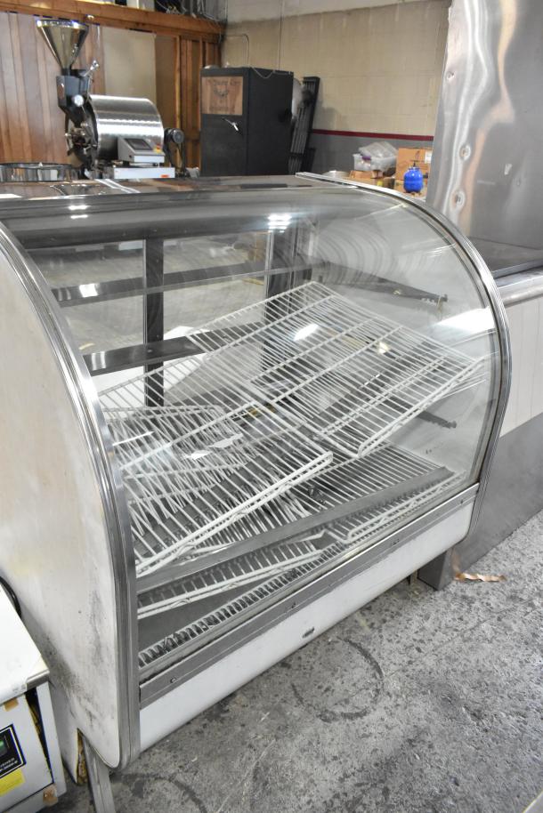 Leader CVK48 S/C deli display case, commercial floor style, metal, 115 volts, 1 phase, glass front, wire shelves, used condition.