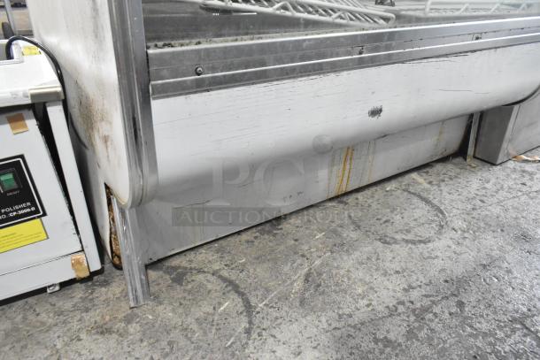 Leader CVK48 S/C metal deli display case. Floor style, visible wear and rust stains, 115 volts, 1 phase.