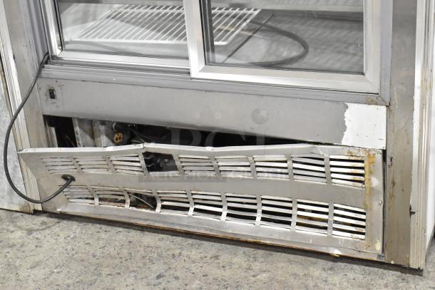 Leader CVK48 S/C metal deli display case, visible dented front grille, suitable for commercial use, 115 Volts, 1 Phase.