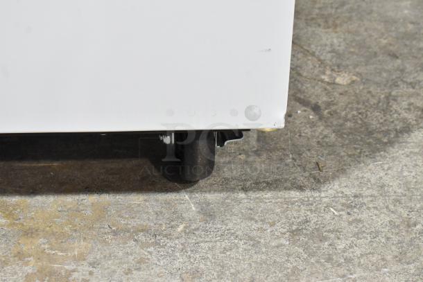 Brand new Avantco 178MC49HC 49" stainless steel milk cooler on commercial casters, minor scratch visible. 115V, 1 Phase.