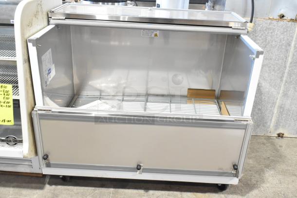 Brand new Avantco 178MC49HC stainless steel 49" school milk cooler with commercial casters, 115V, 1 Phase.